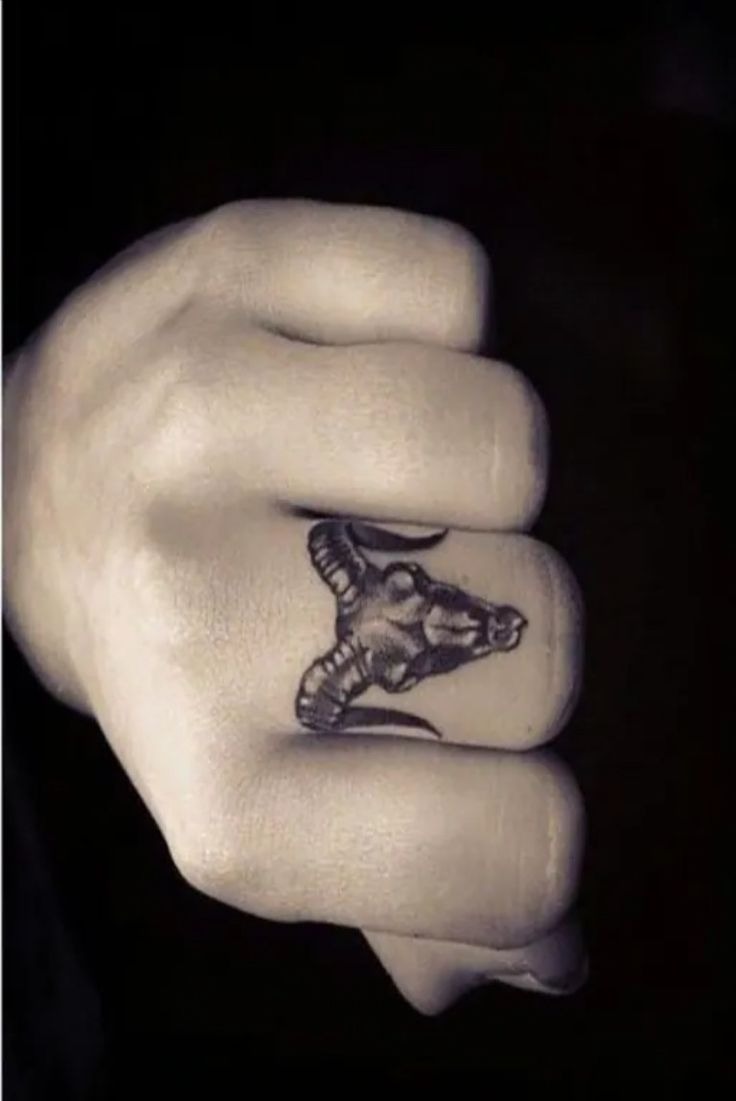 Dark Ram Head on Finger Tattoo Design