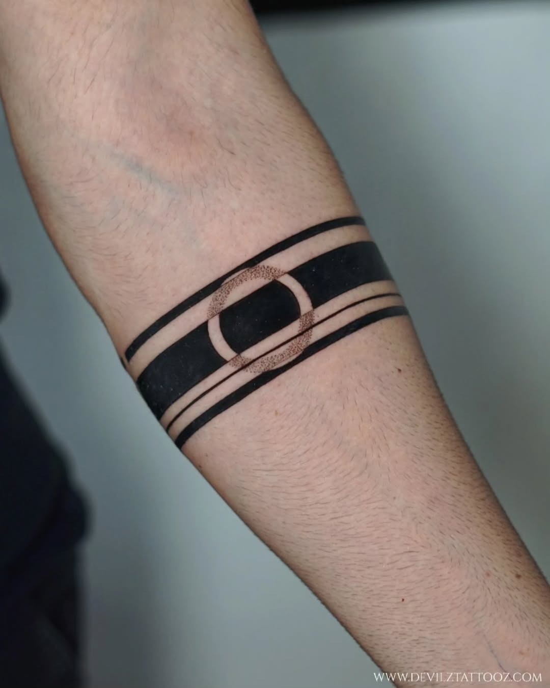 Bold armband tattoo featuring sleek design elements. Tattoo Design