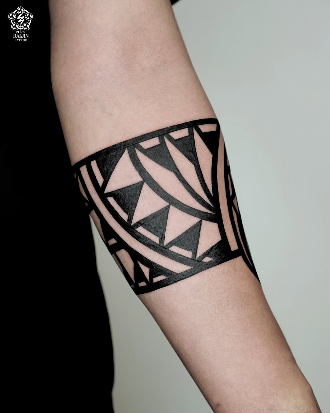 Bold geometric armband tattoo for statement style Tattoo Design