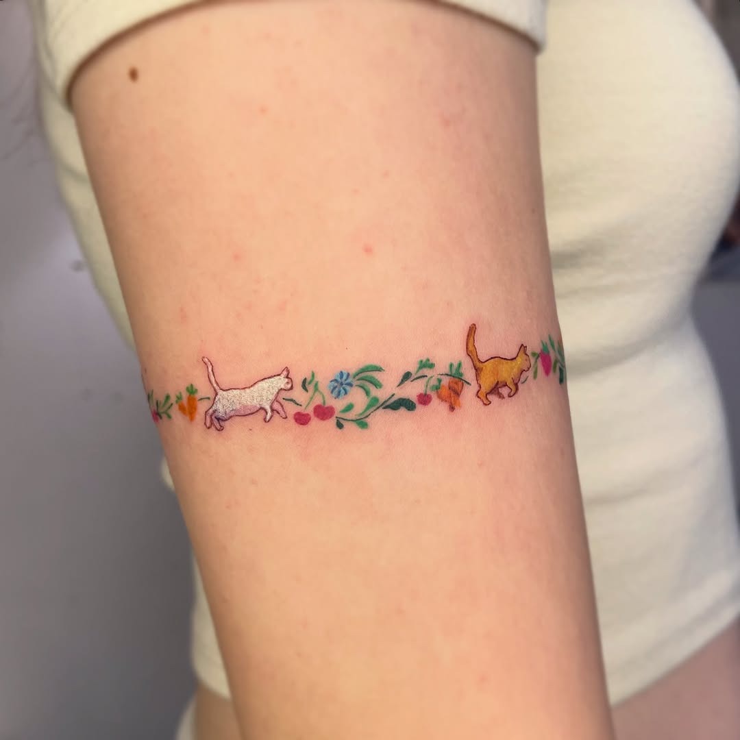 Charming armband cats with floral accents Tattoo Design