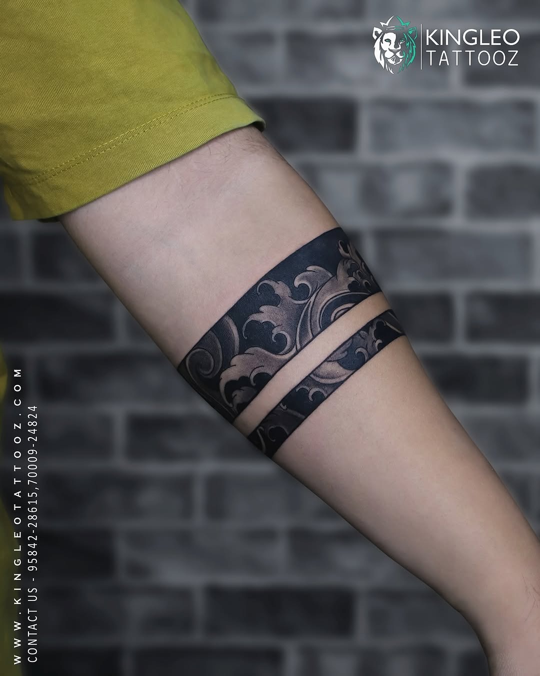 Elegant black armband tattoo with floral patterns Tattoo Design
