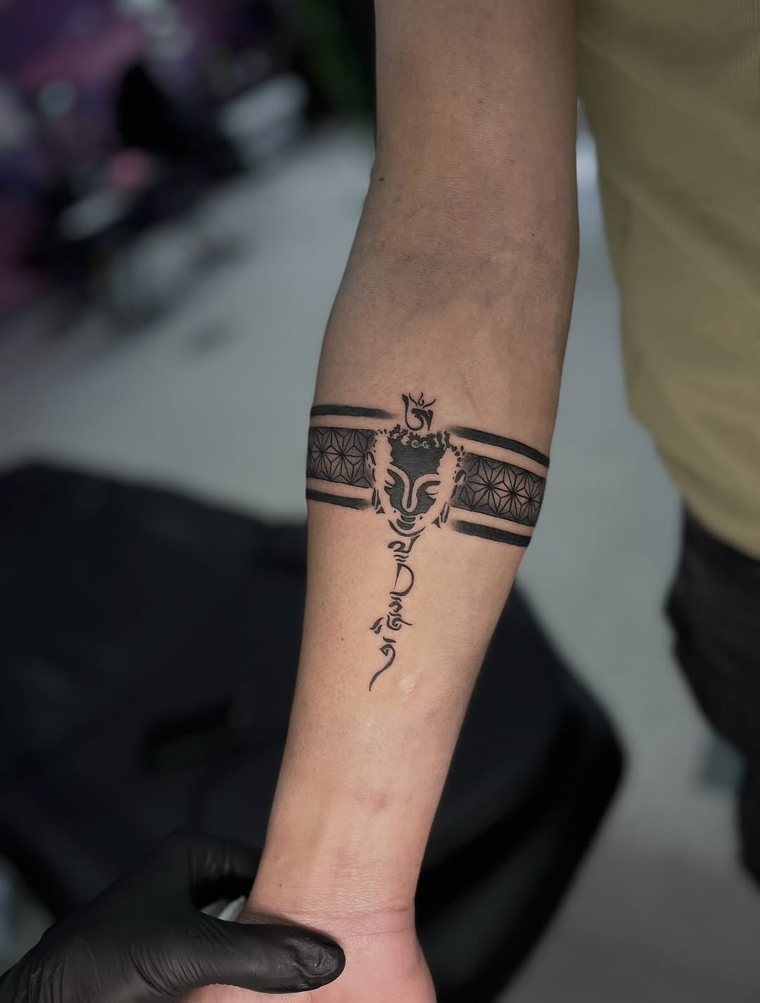 Intricate black armband tattoo with unique pattern Tattoo Design