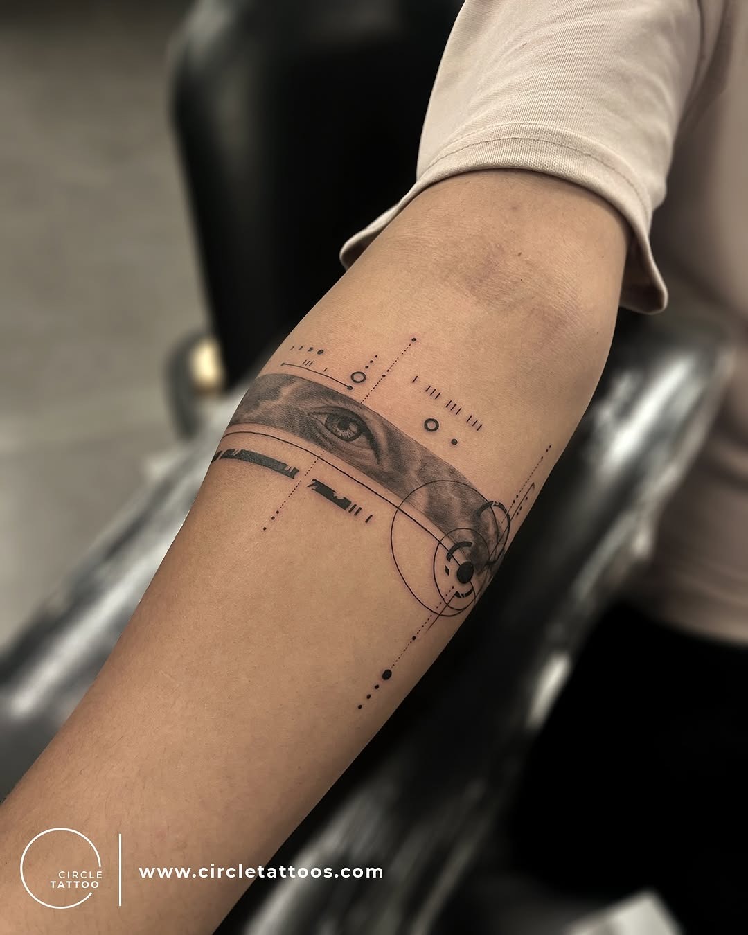 Intricate geometric armband tattoo featuring an eye Tattoo Design