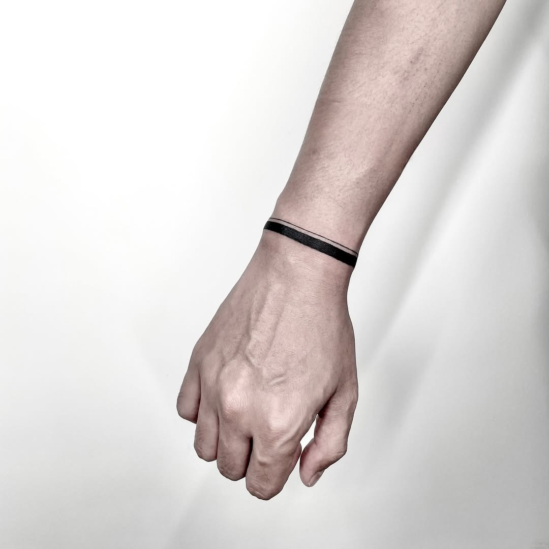 Minimalist armband tattoo with sleek design Tattoo Design