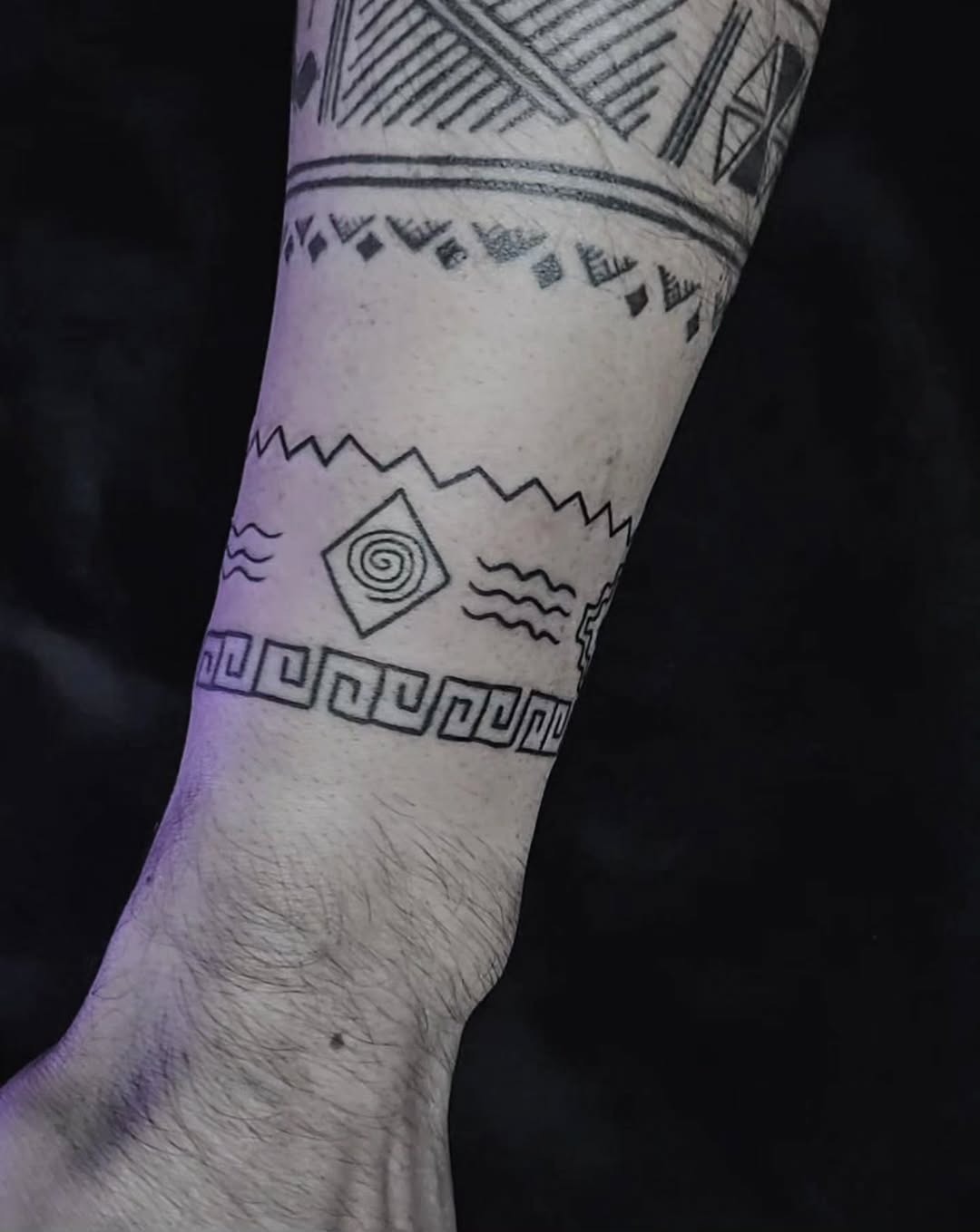 Unique geometric armband tattoo with cultural elements Tattoo Design