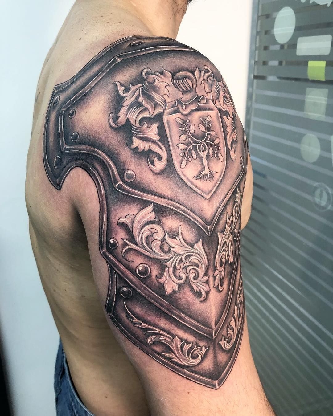 Baroque Shoulder Armor with Heraldic Crest Tattoo Design