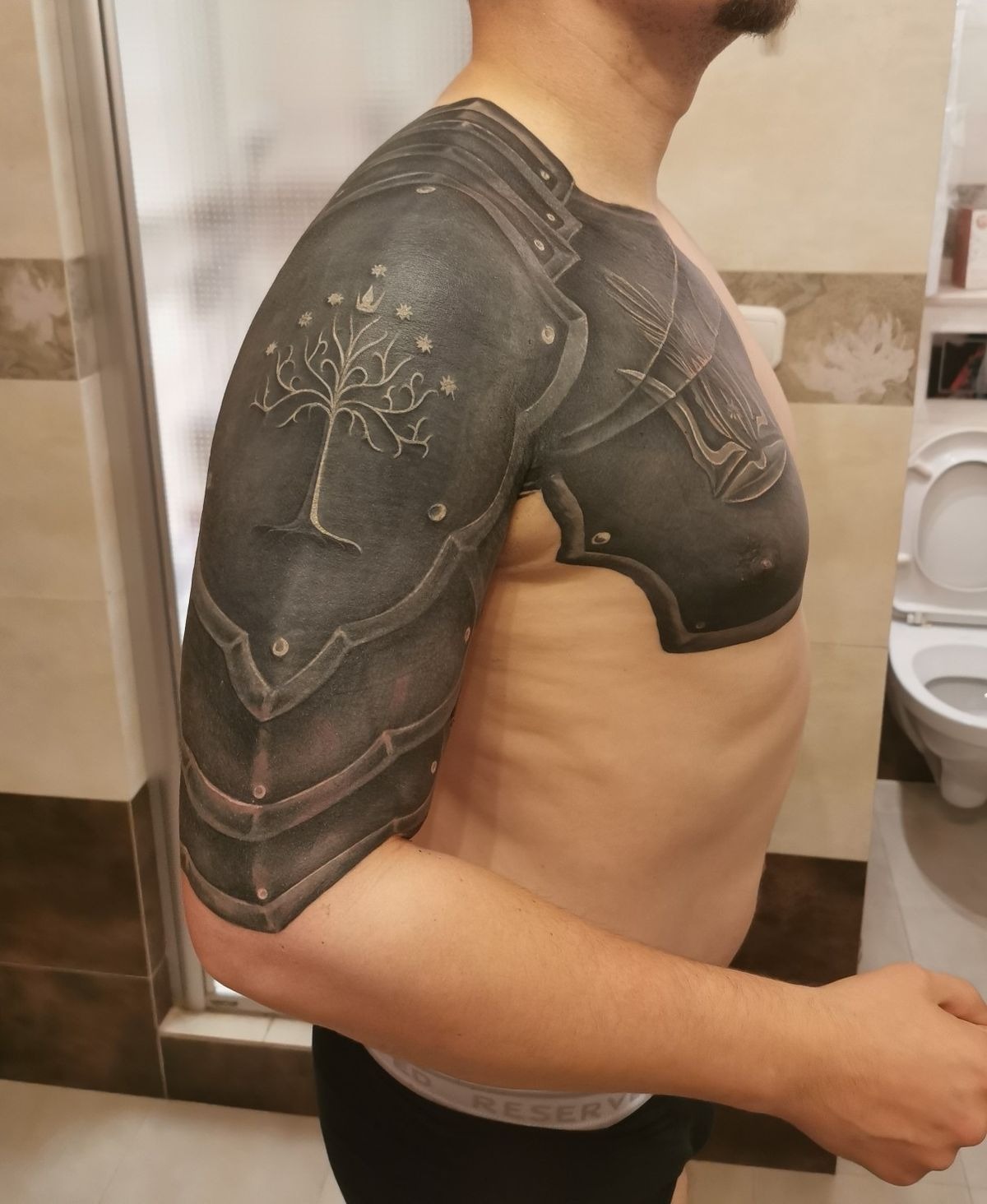 Layered Plate Shoulder and Chest Armor Tattoo Design