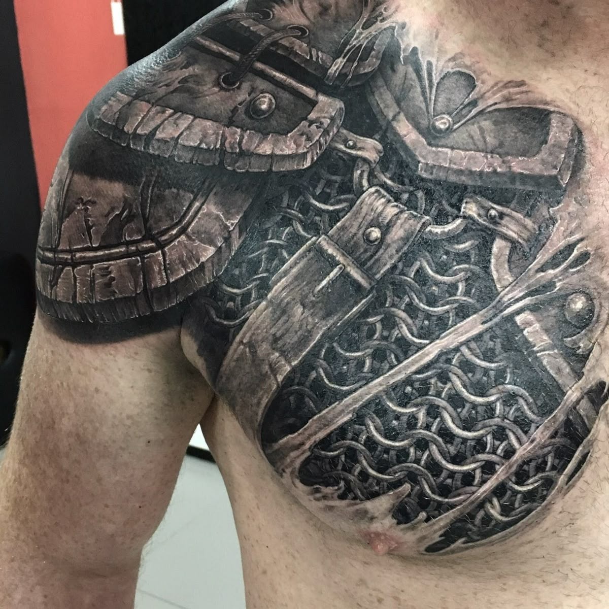 Viking-Inspired Chainmail Chest Armor Tattoo Design