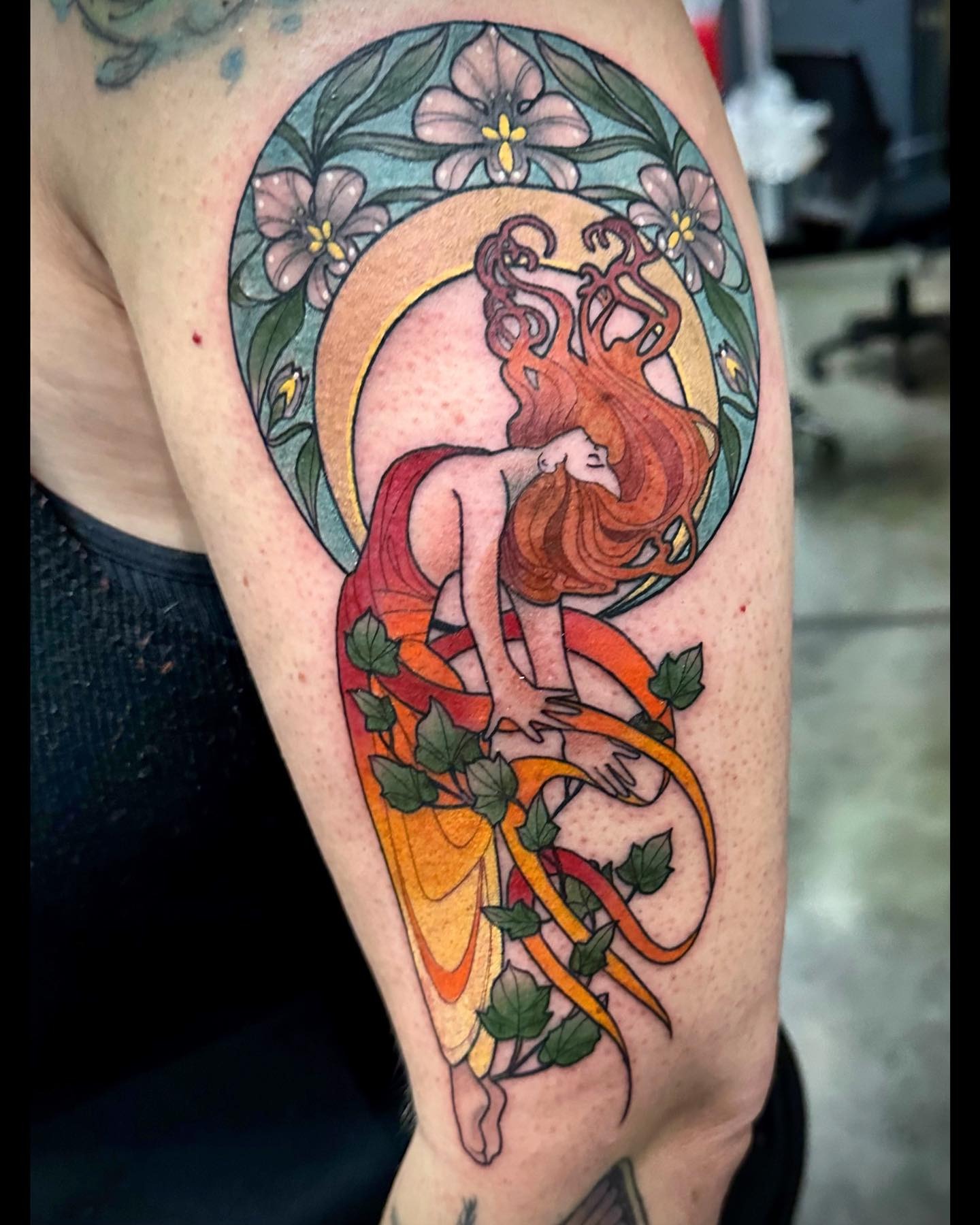 Elegant Art Nouveau Woman Surrounded by Flora Tattoo Design