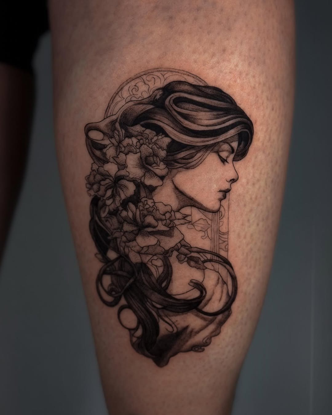 Elegant Art Nouveau Woman with Floral Accents Tattoo Design