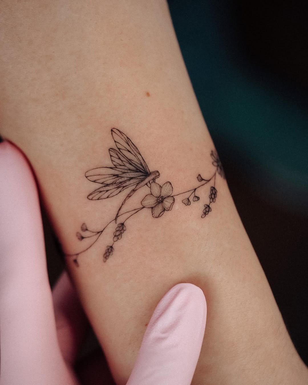Delicate dragonfly tattoo with floral elements Tattoo Design