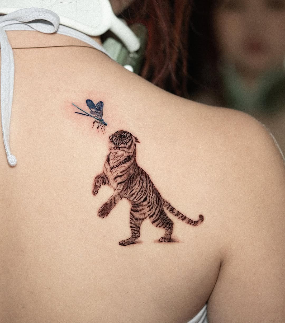 Dynamic tattoo of a tiger with dragonfly Tattoo Design