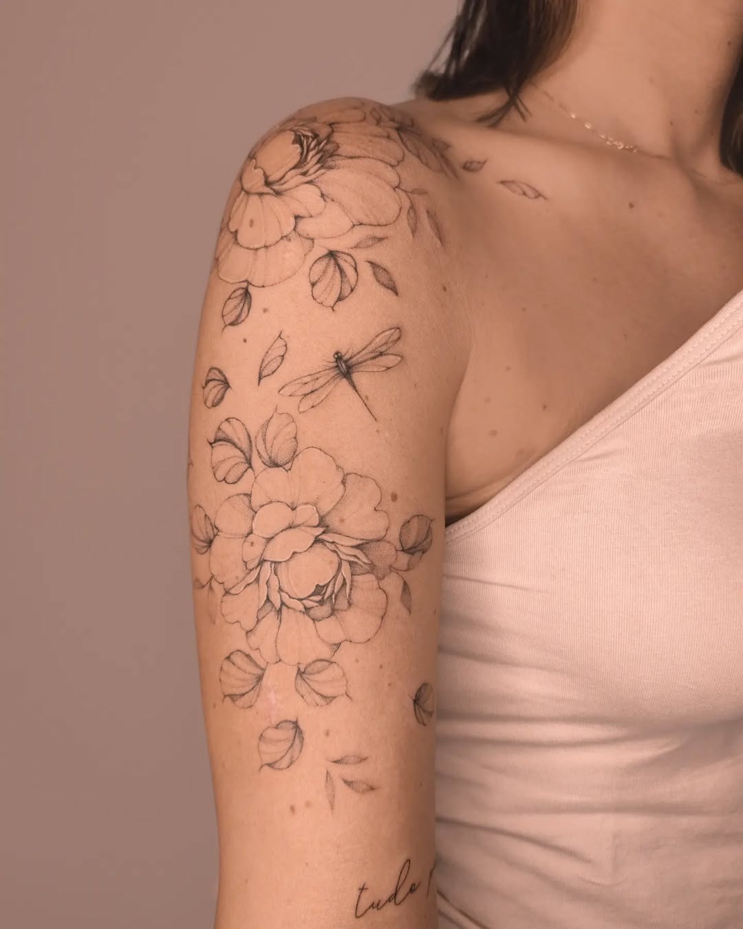 Elegant dragonfly tattoo among floral designs Tattoo Design