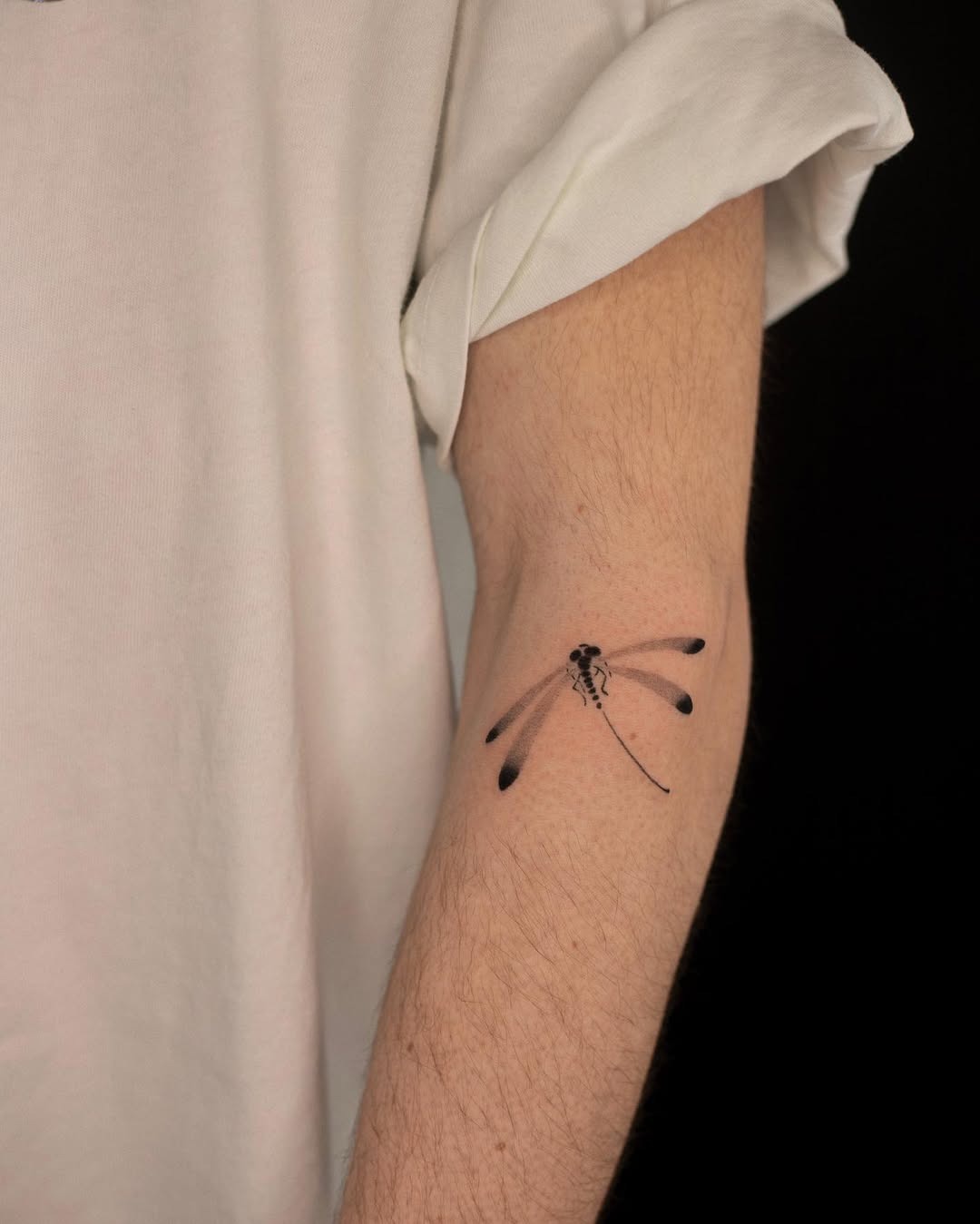 Elegant Dragonfly Tattoo on a Forearm Tattoo Design