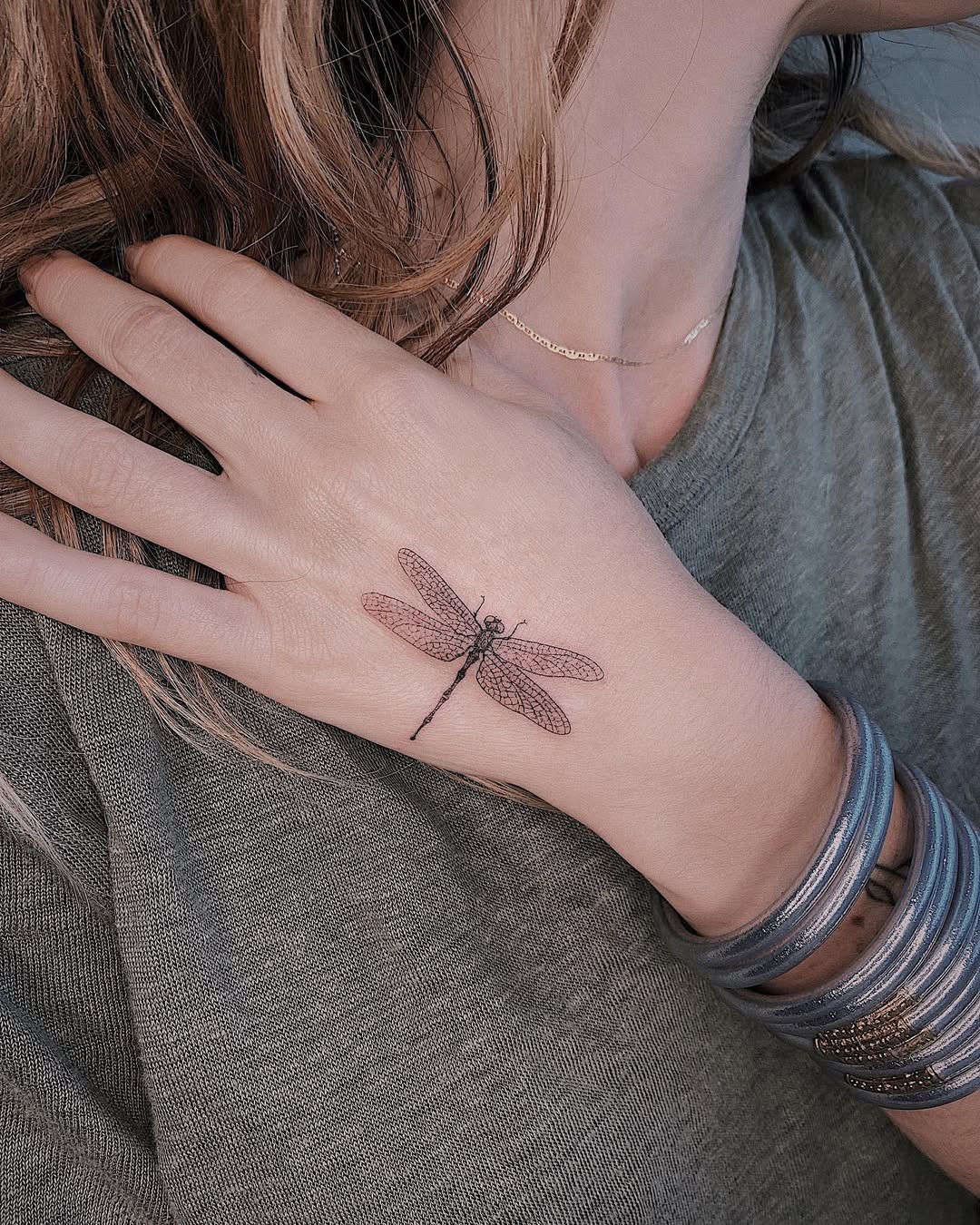 Elegant dragonfly tattoo on a hand Tattoo Design
