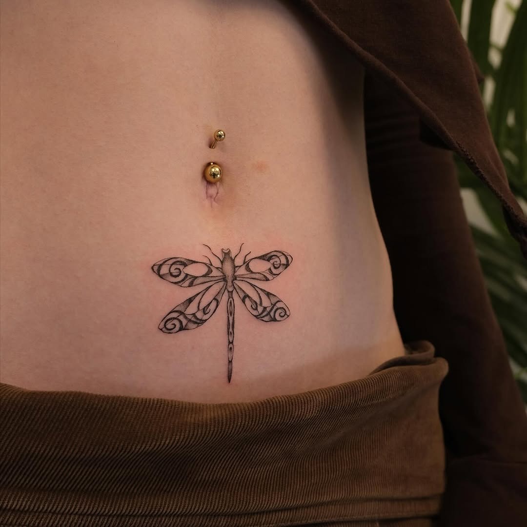Elegant dragonfly tattoo on a smooth belly Tattoo Design