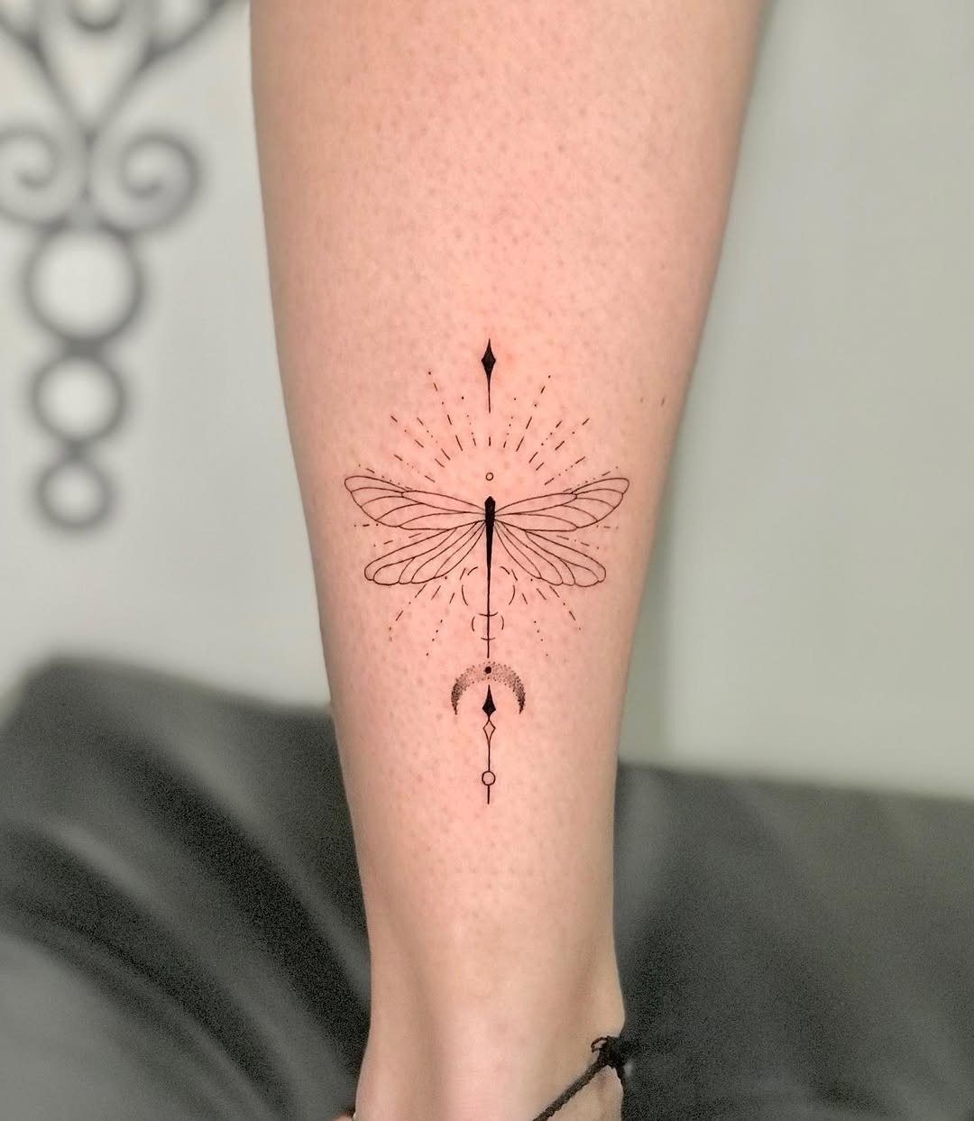 Elegant dragonfly tattoo with geometric elements Tattoo Design