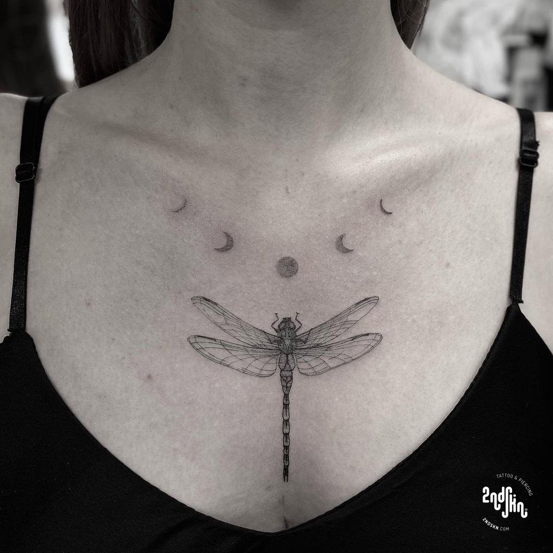 Elegant dragonfly tattoo with moons above Tattoo Design
