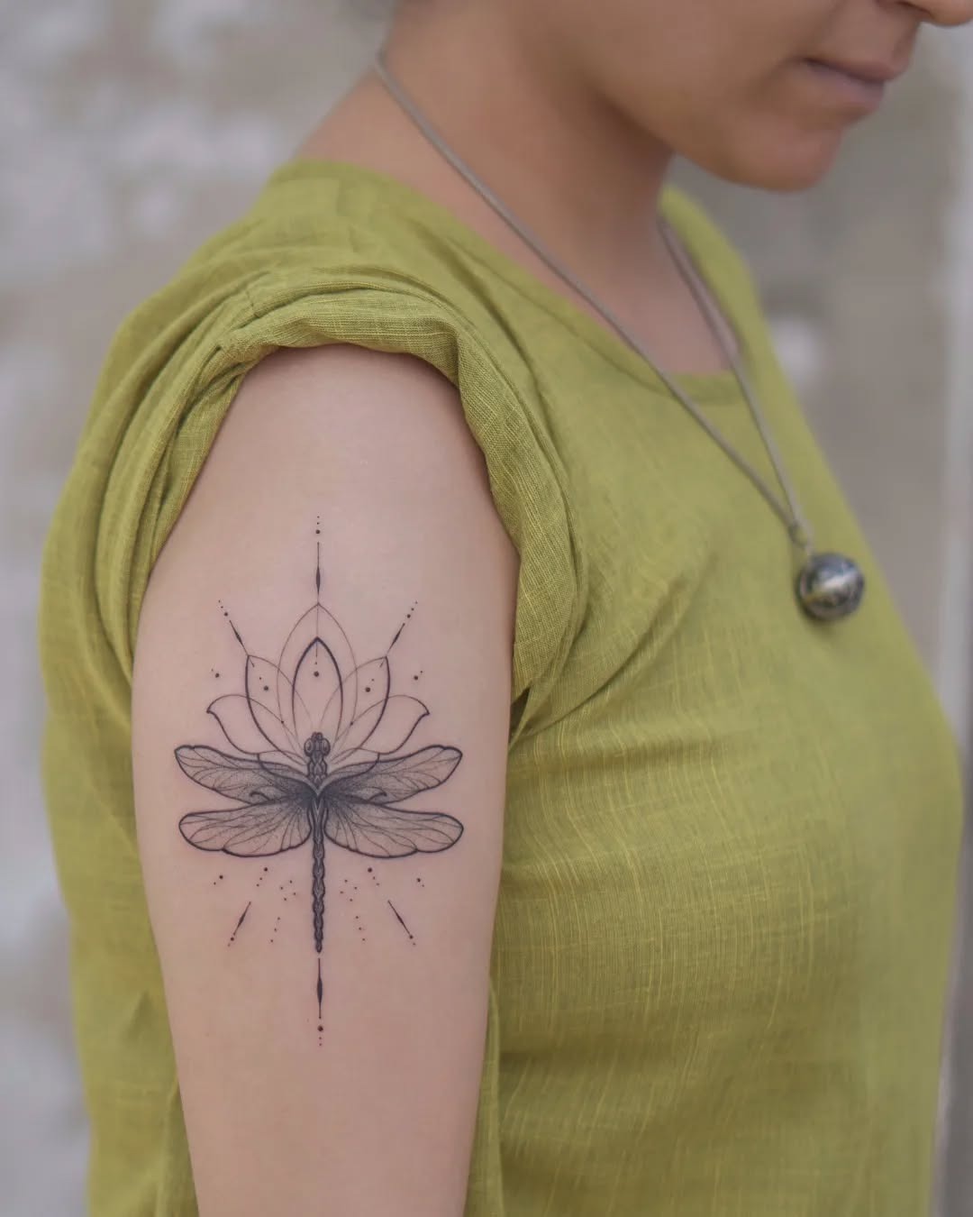 Intricate dragonfly and lotus tattoo on arm Tattoo Design
