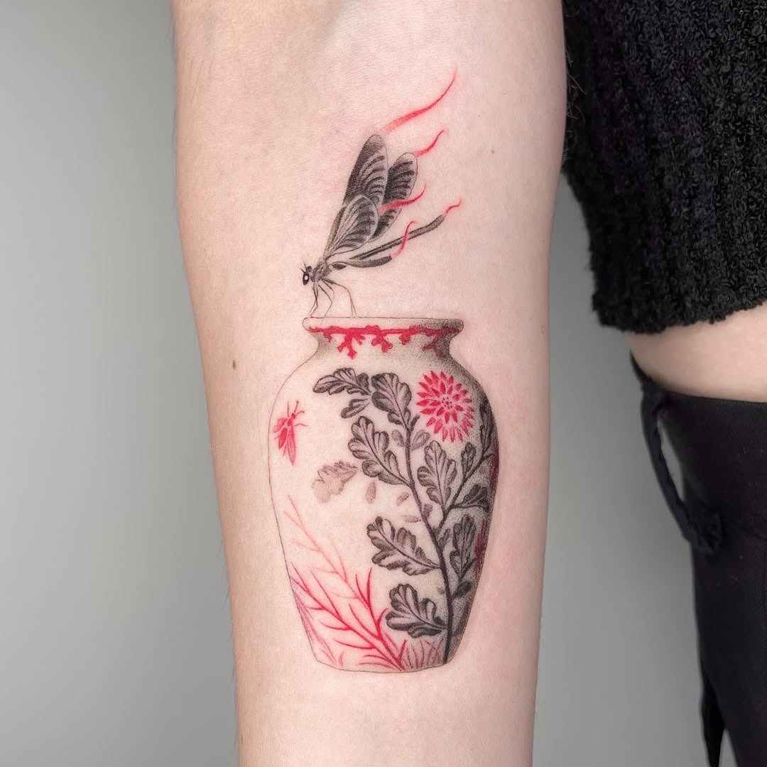 Intricate dragonfly tattoo with floral vase design Tattoo Design
