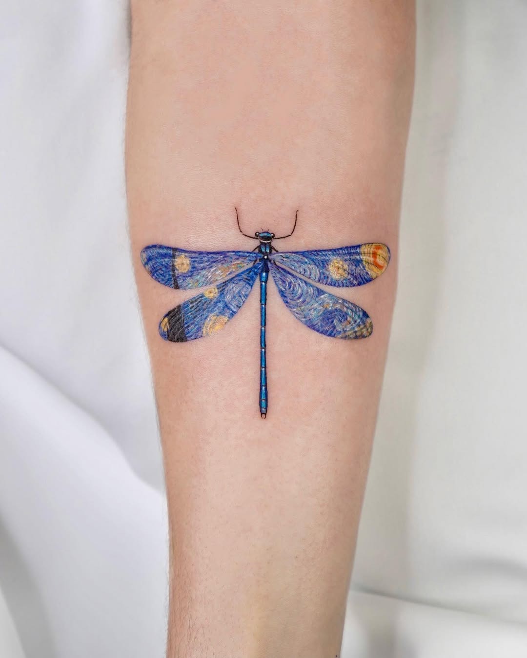 Stunning artistic dragonfly tattoo on arm Tattoo Design