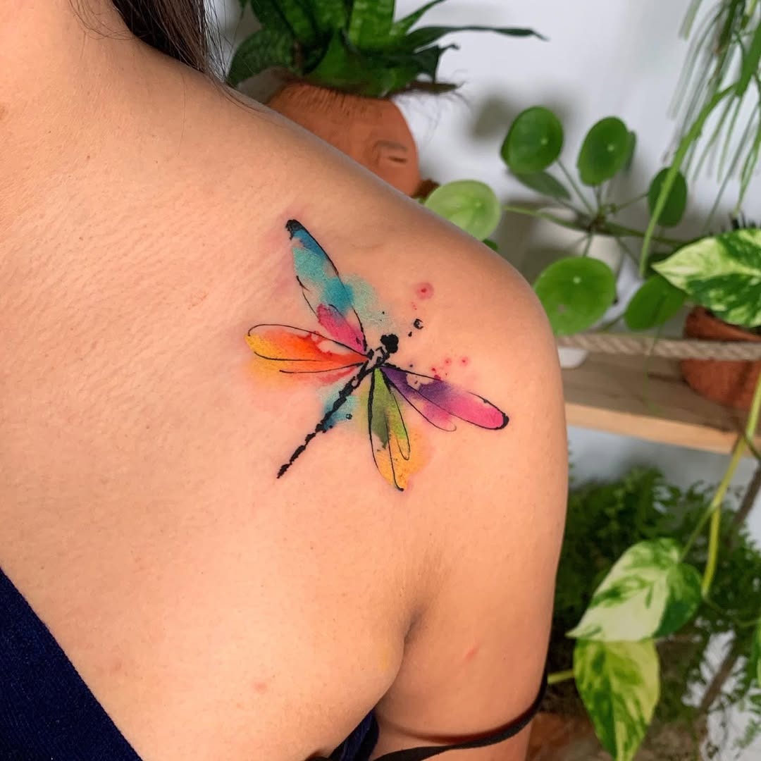 Vibrant watercolor dragonfly tattoo on shoulder Tattoo Design