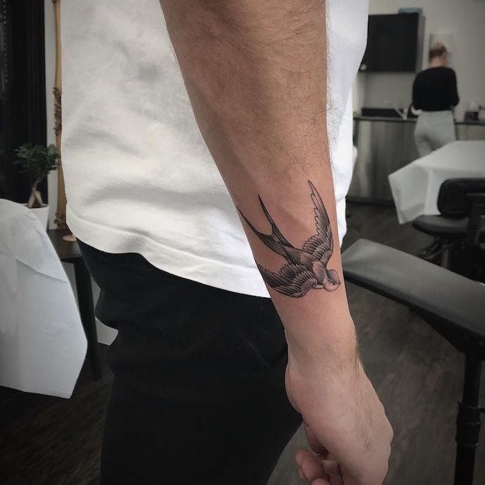 The simplicity of a swallow in flight makes for an elegant and unique tattoo choice, especially for those seeking a design that is both subtle and meaningful.