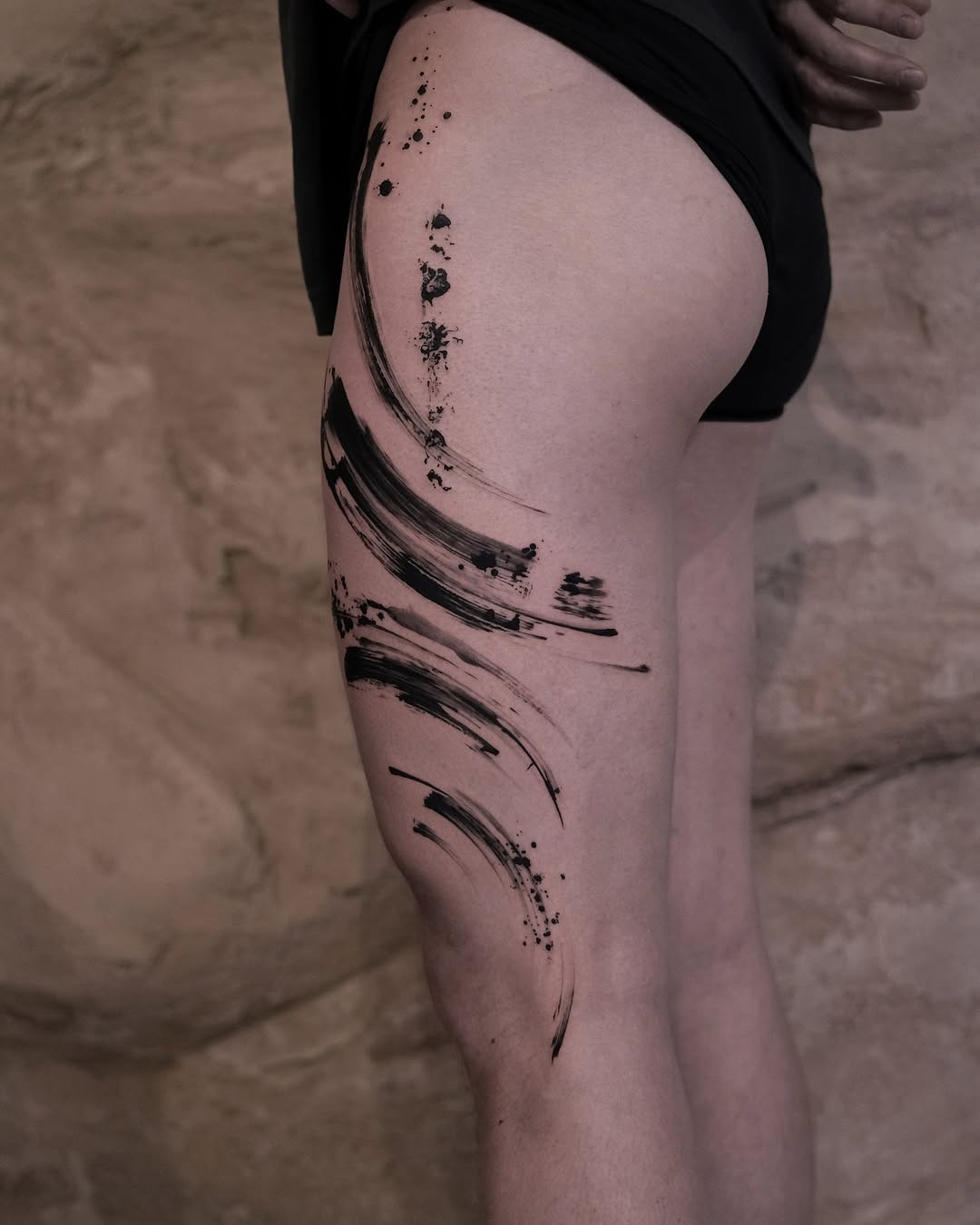Bold abstract ink strokes on thigh Tattoo Design