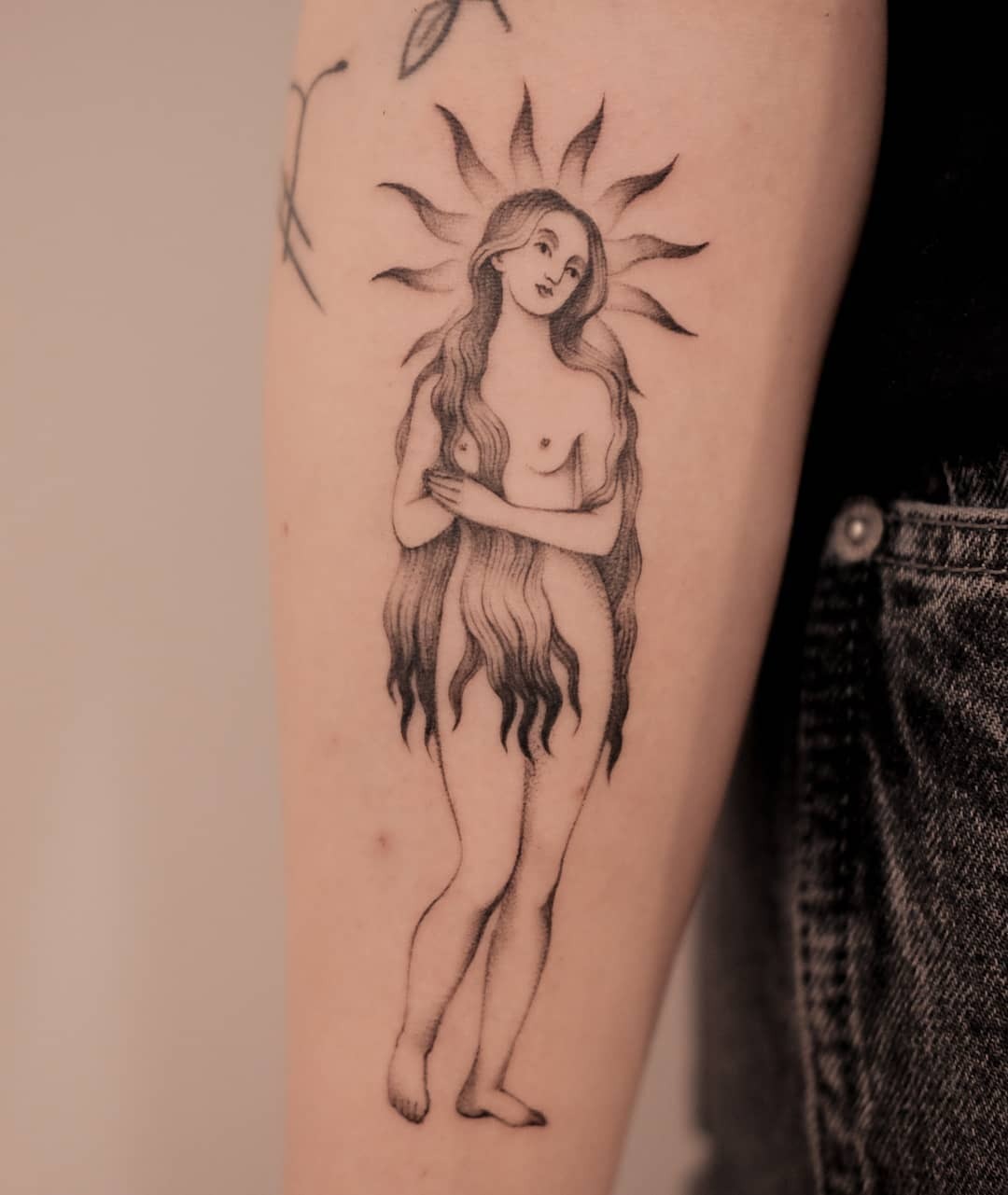Captivating sun goddess tattoo in black ink Tattoo Design