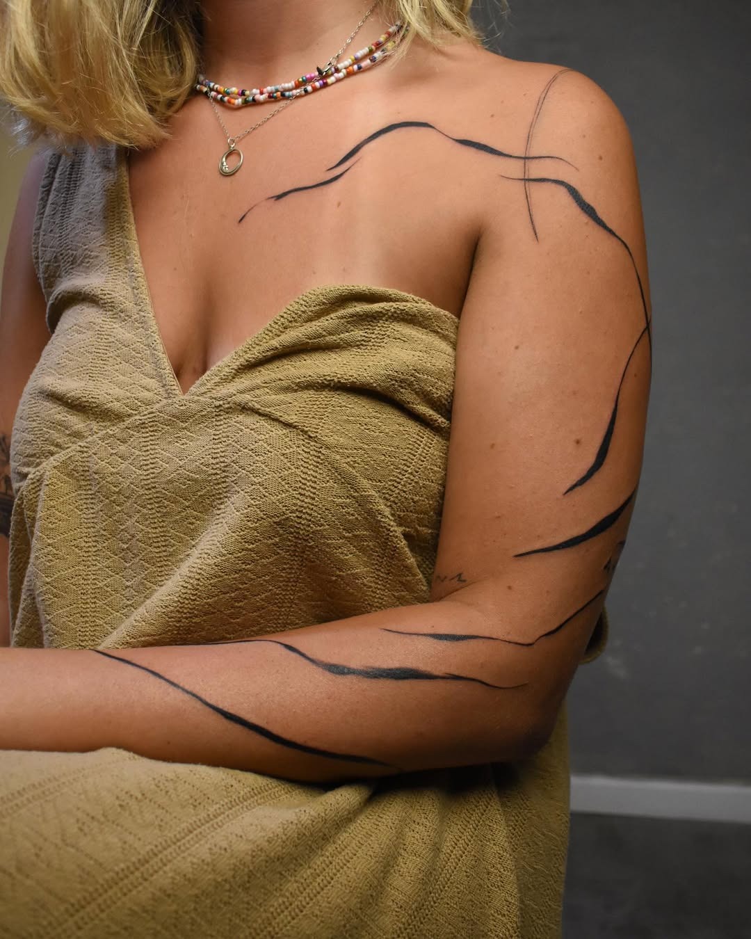 Elegant minimalistic tattoos with flowing lines Tattoo Design