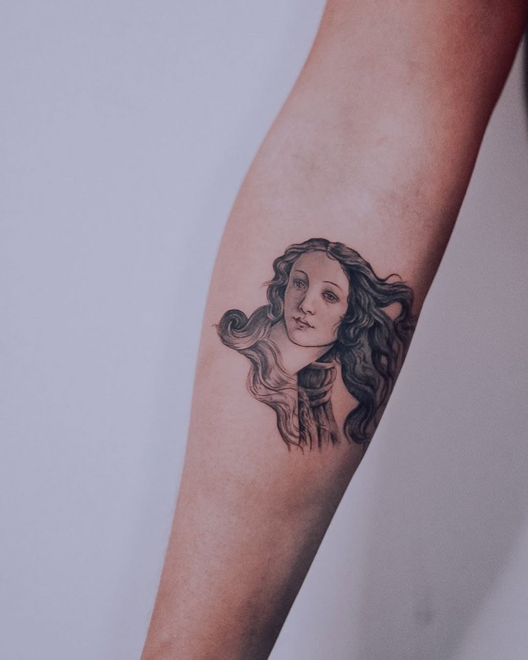 Elegant portrait tattoo on a graceful forearm Tattoo Design