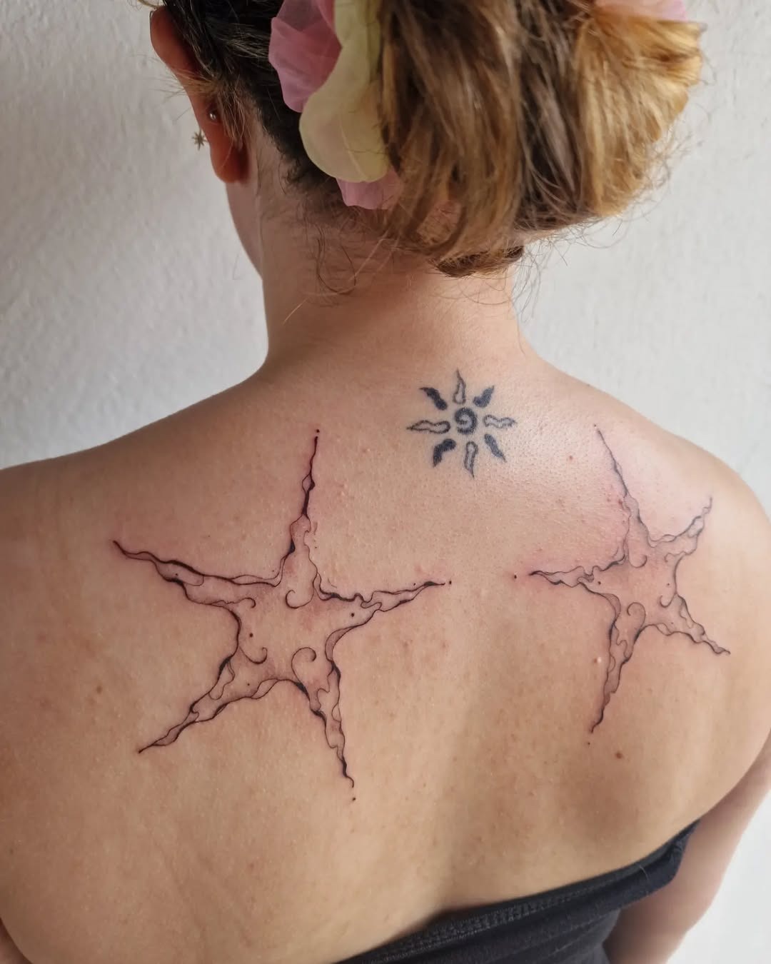 Intricate star tattoos with playful ink details Tattoo Design