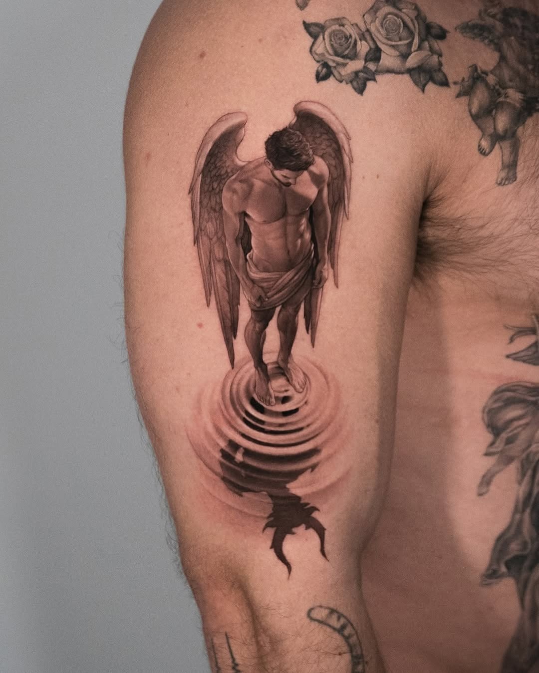 Stunning angel tattoo with reflective water effect Tattoo Design