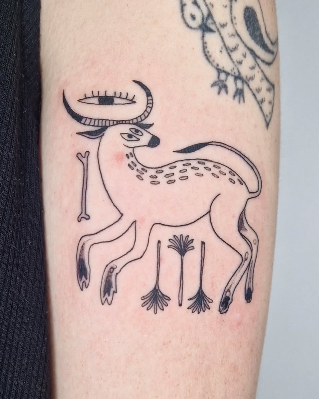 Stylized deer tattoo in black ink Tattoo Design