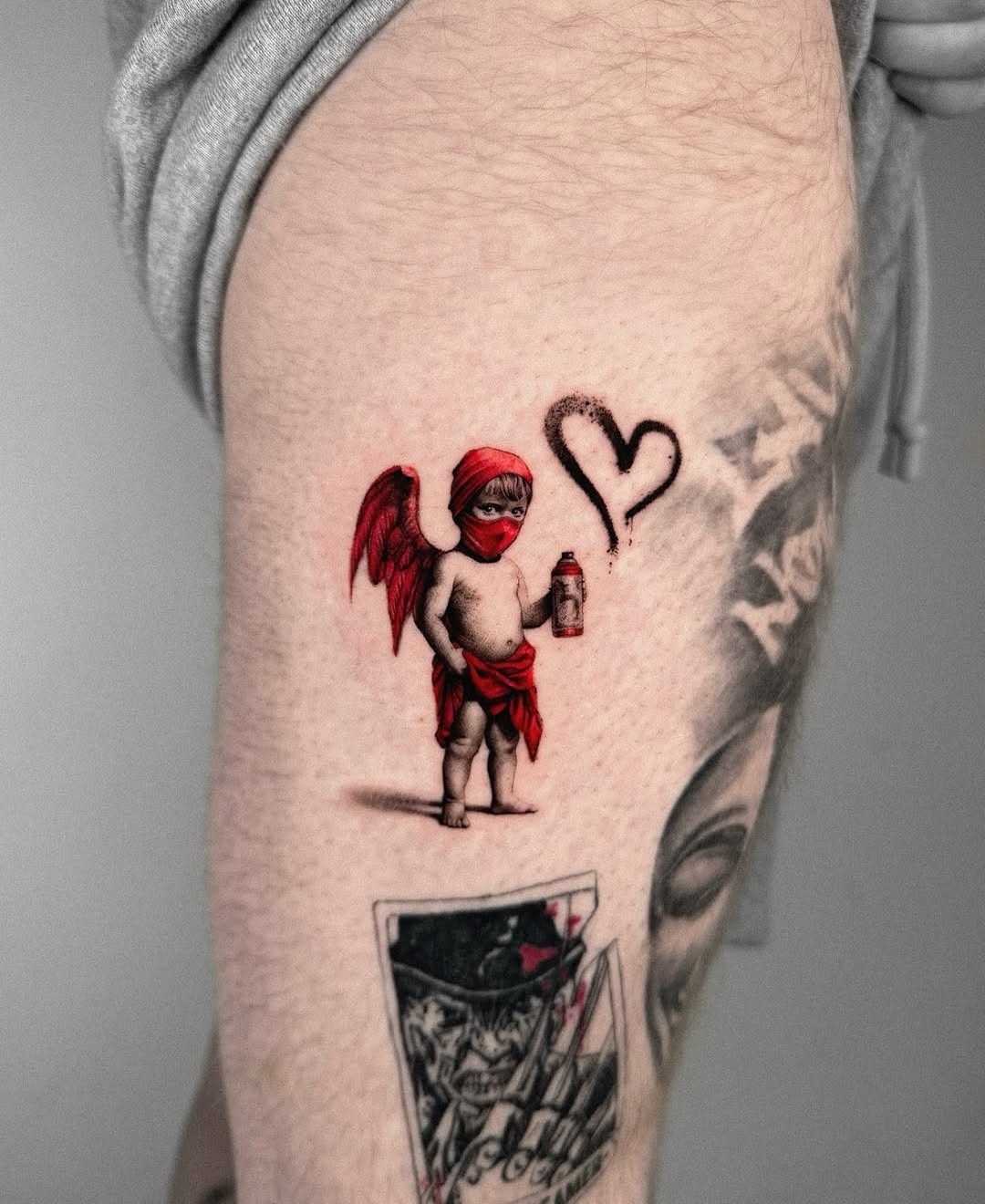 Whimsical cherubic tattoo with a playful twist Tattoo Design