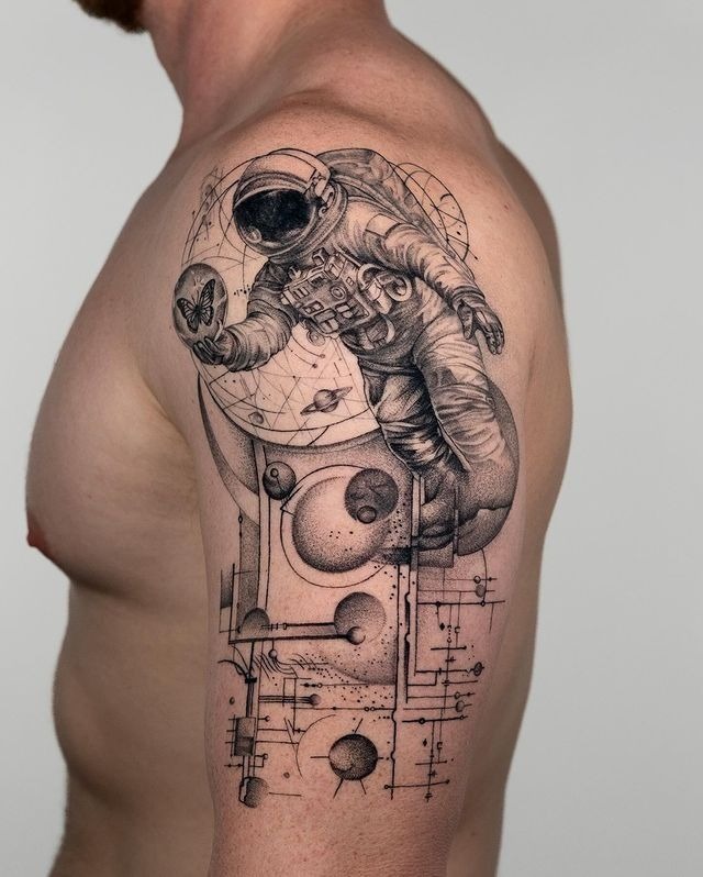 Astronaut Sitting on Saturn Tattoo Design