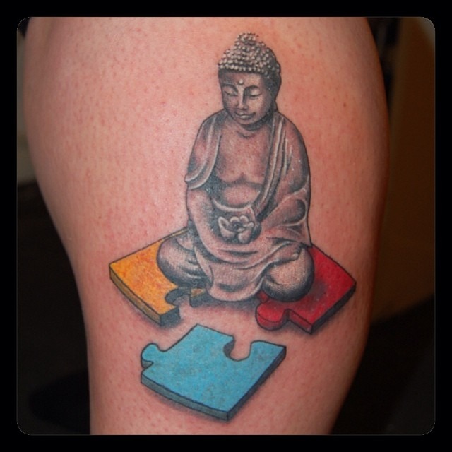 Buddha Tattoo Symbolizing Peace and Autism Awareness Tattoo Design
