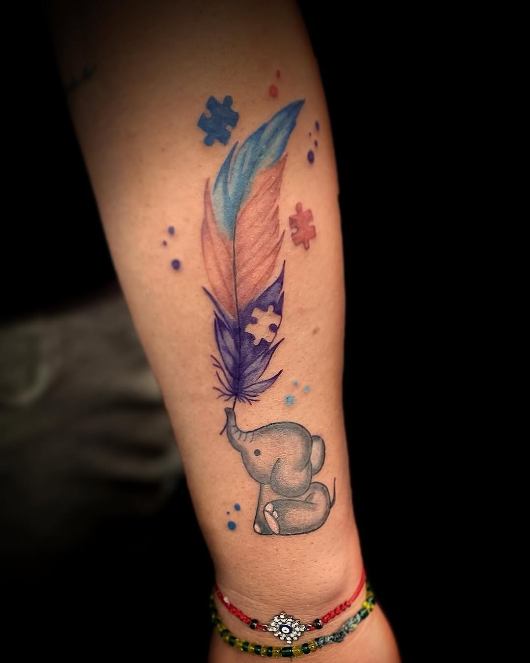 Colorful elephant and feather tattoo design Tattoo Design