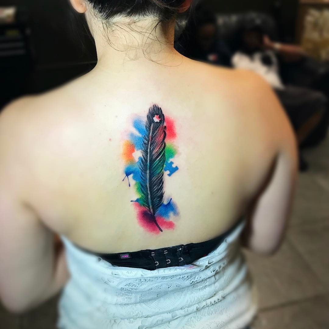 Colorful feather tattoo celebrating autism awareness Tattoo Design