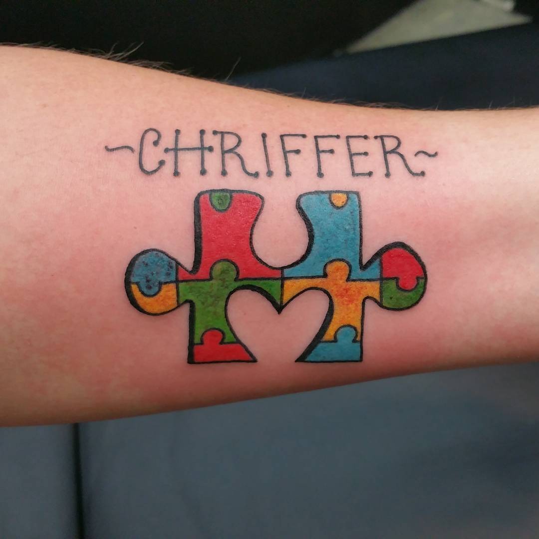 Colorful puzzle tattoo with artistic flair Tattoo Design