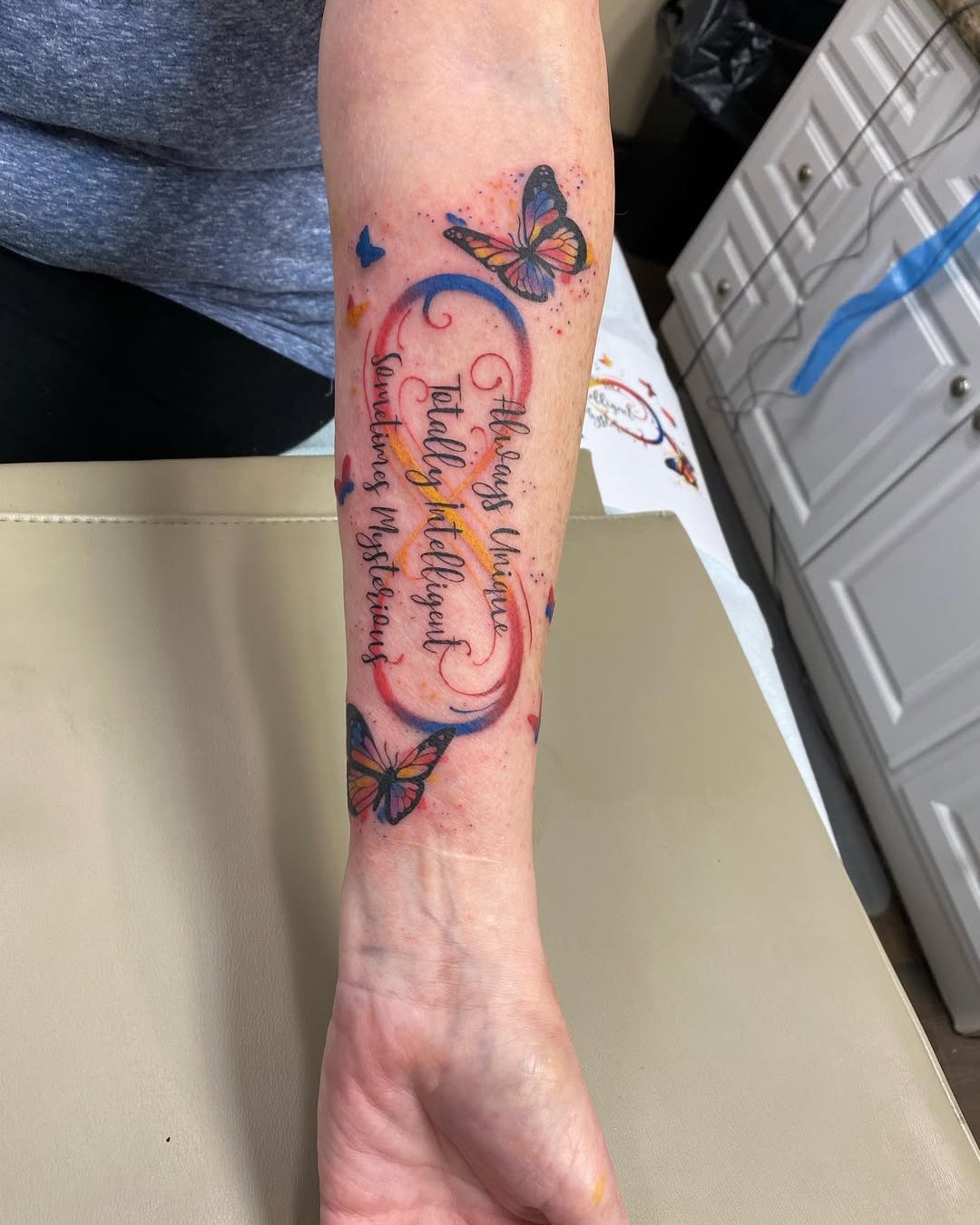 Colorful tribute to autism with butterflies Tattoo Design