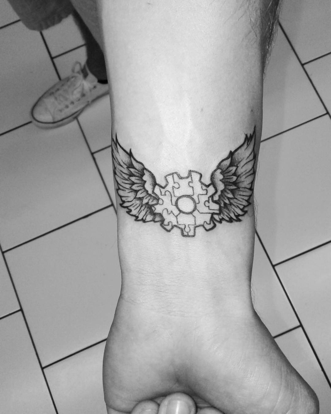 Symbolic autism tattoo with angelic wings Tattoo Design