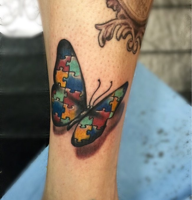 Vibrant butterfly symbolizing autism awareness and growth Tattoo Design