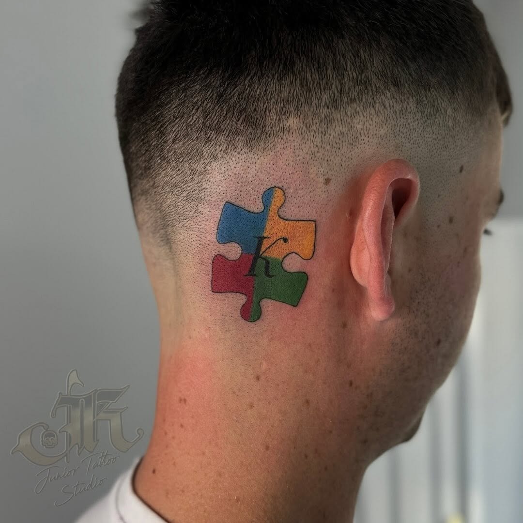 Vibrant Puzzle Piece Symbolizing Autism Awareness Tattoo Design