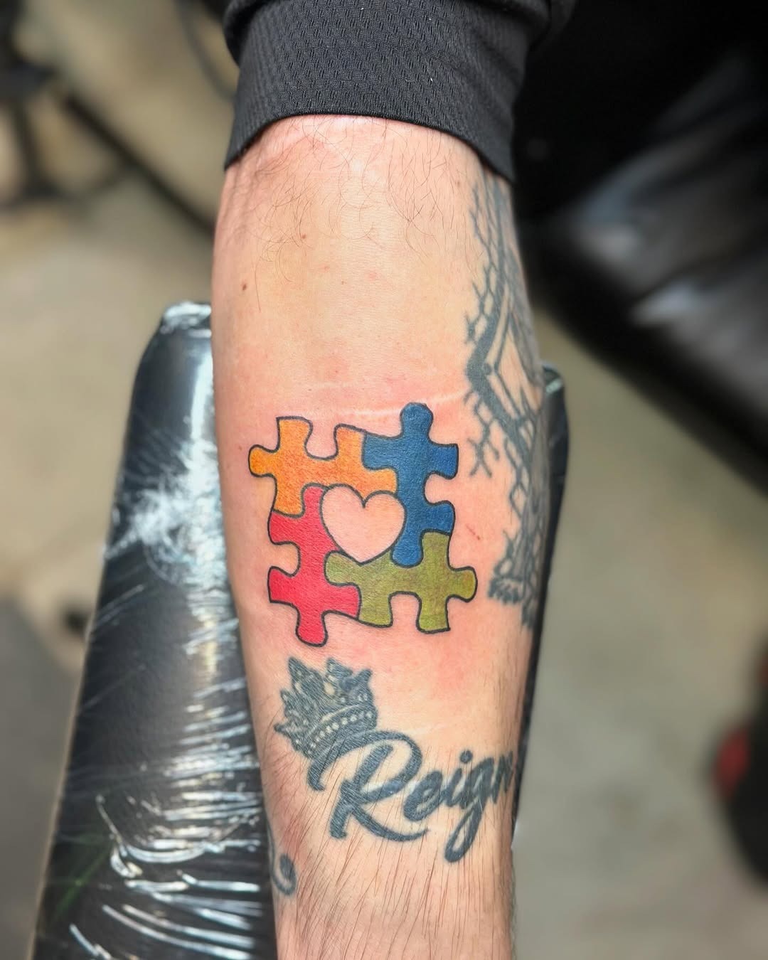 Vibrant puzzle piece tattoo with heart design Tattoo Design