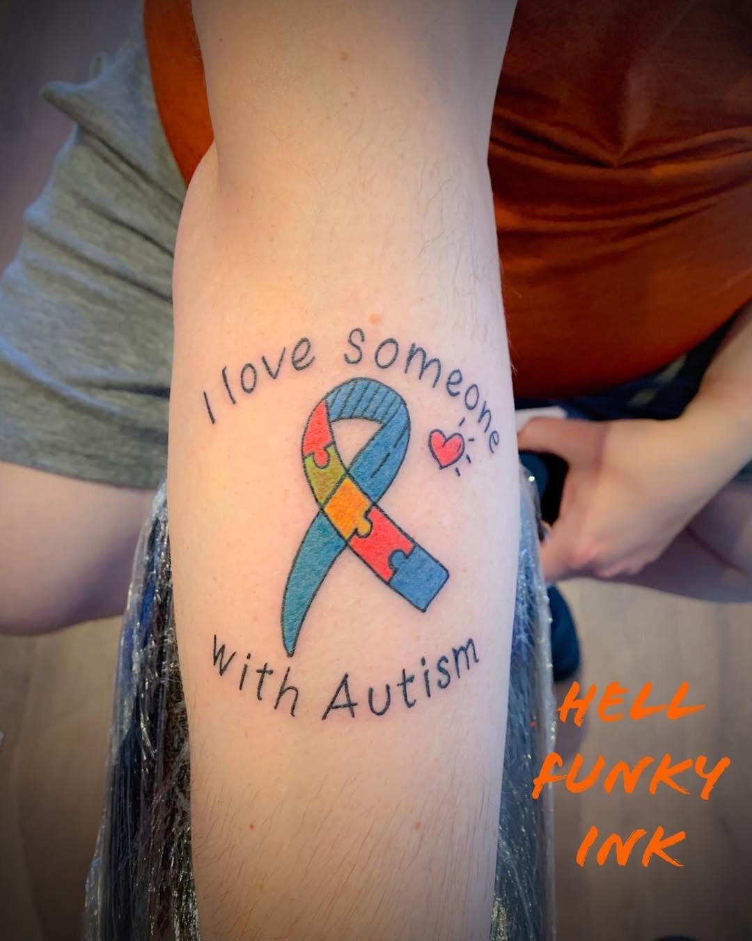 Vibrant tattoo expressing love for autism Tattoo Design