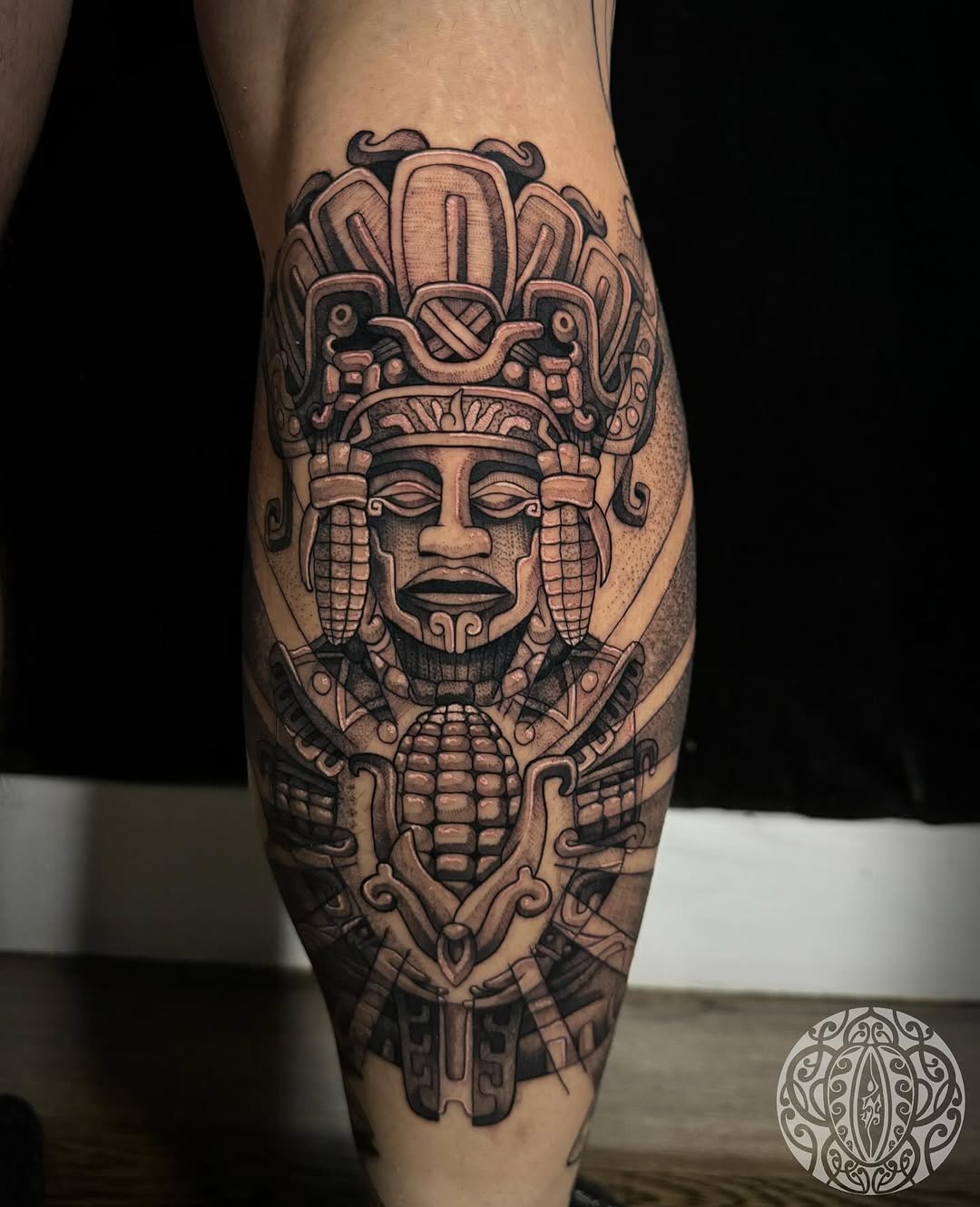 Intricate Aztec God Tattoo on Leg Tattoo Design
