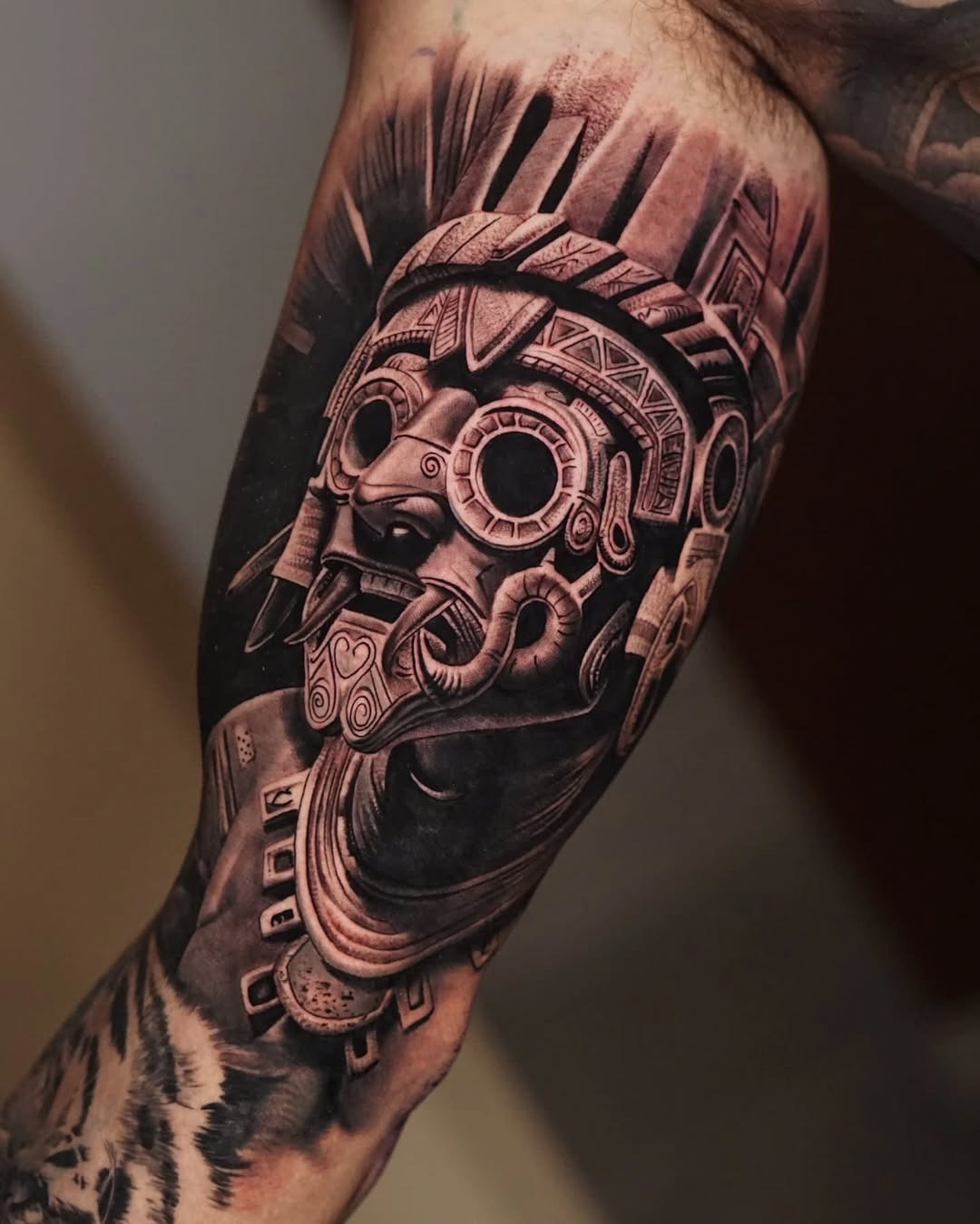 Intricate Aztec statue tattoo on forearm Tattoo Design