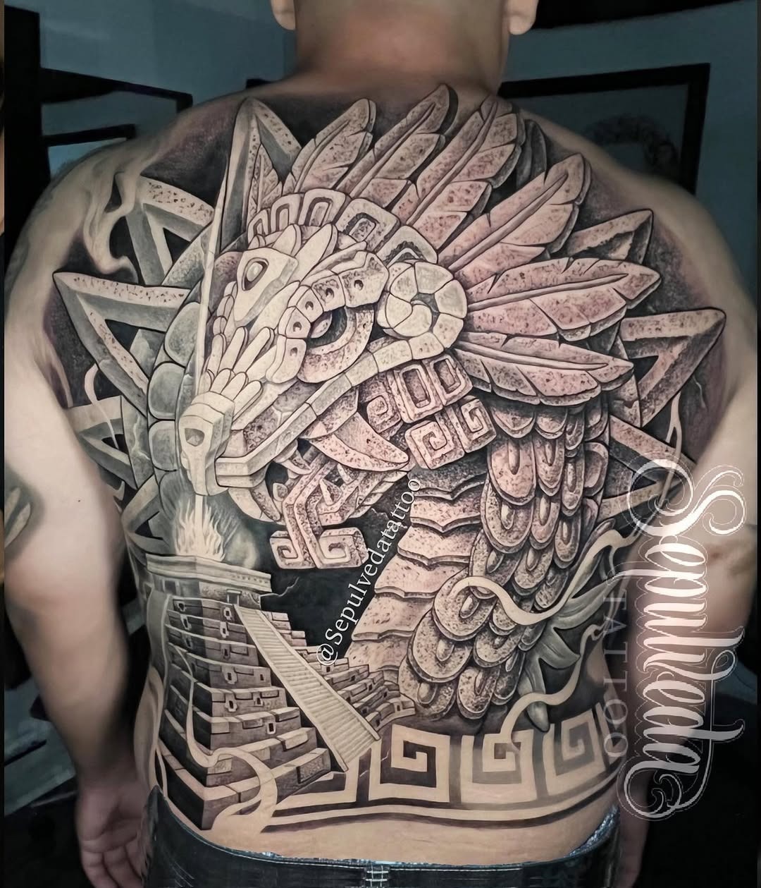 Intricate Aztec Tattoo on Back with Feathered Serpent Tattoo Design