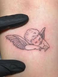 Angel Cradled in Wings Tattoo Design